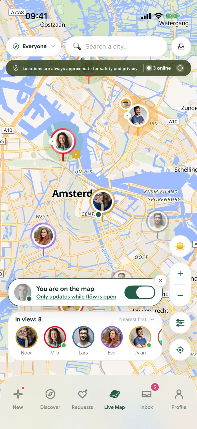 The Live Map in the flōw app with members shown as photo pins around Amsterdam