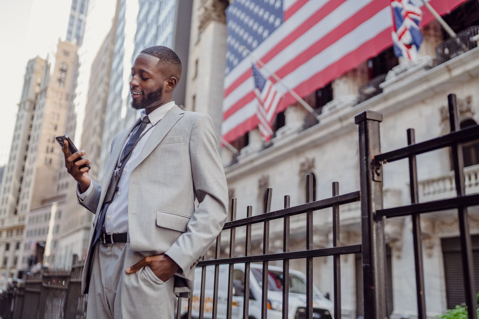 Man checking his phone on a city street