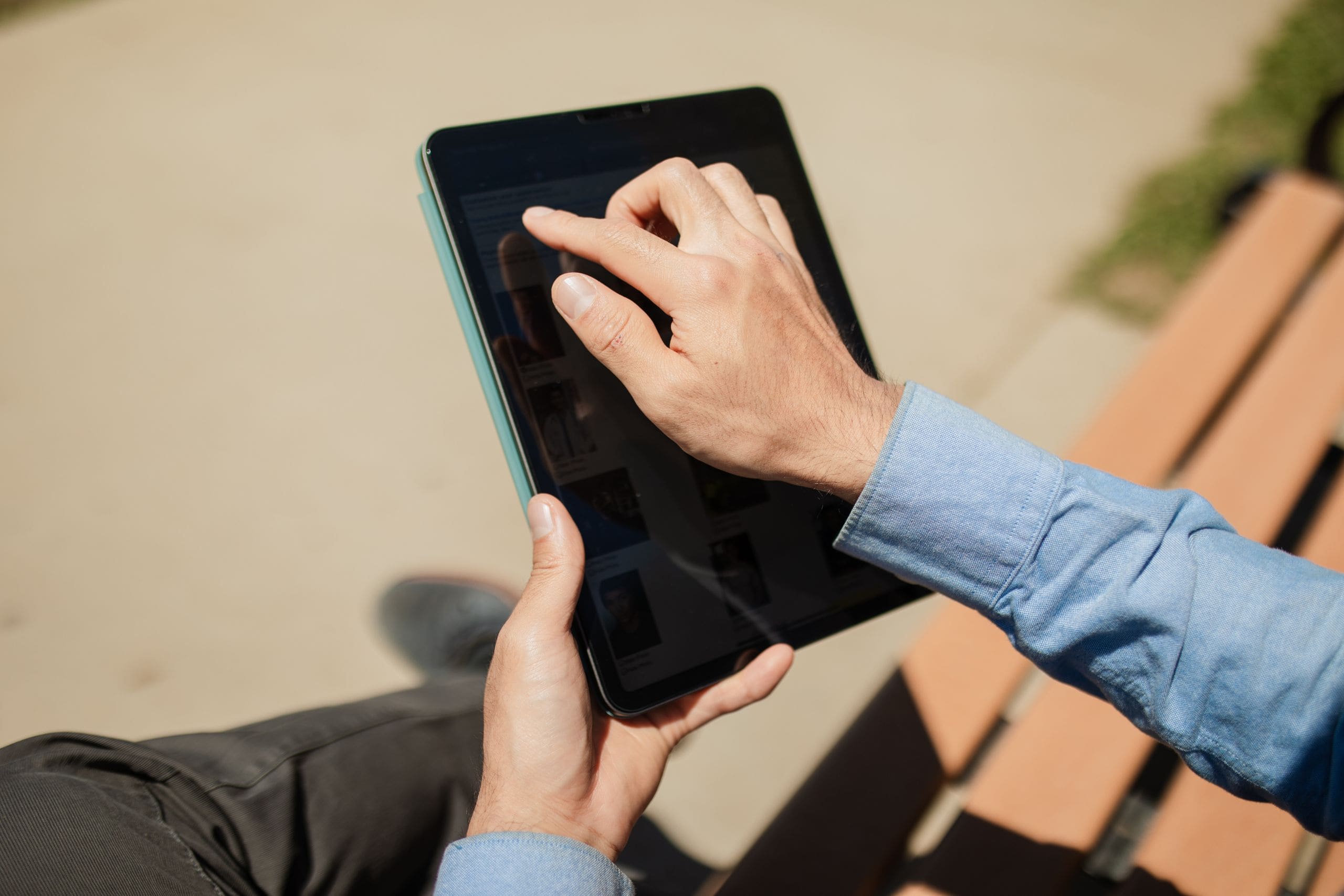 Person using a tablet outdoors