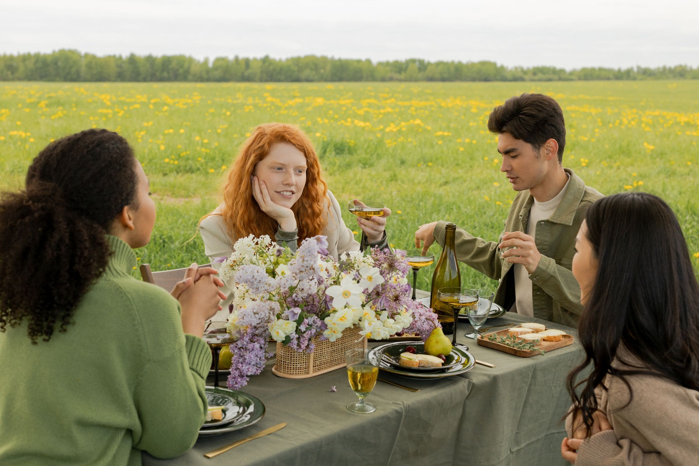 Group of friends enjoying a picnic outdoors