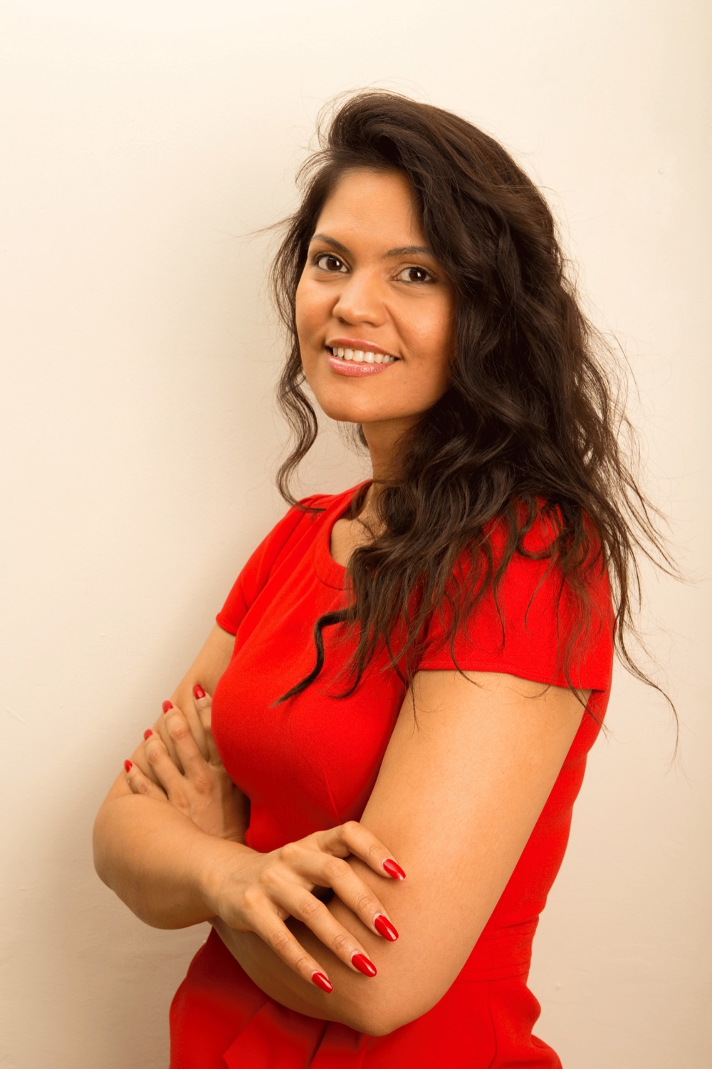 Woman smiling in a red dress